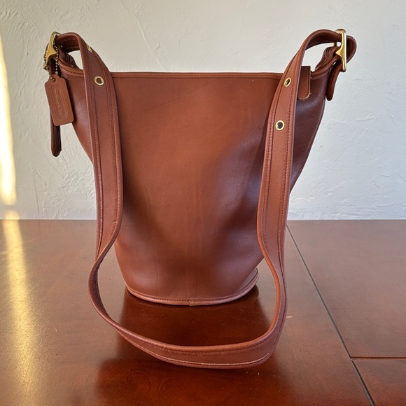 Coach Handbags - Coach Vintage Tan Leather Duffle Sac Bucket Bag